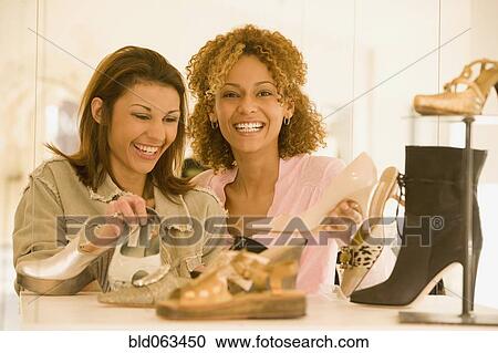 Multi-ethnic women shoe shopping View Large Photo Image Stock Image - Multi-ethnic women shoe shopping. Fotosearch