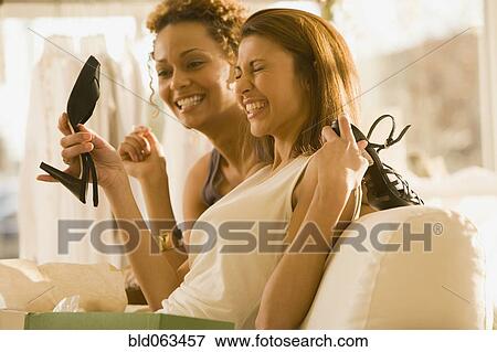 Multi-ethnic women shoe shopping View Large Photo Image Stock Photo - Multi-ethnic women shoe shopping. Fotosearch
