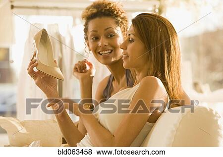 Multi-ethnic women shoe shopping View Large Photo Image Stock Photo - Multi-ethnic women shoe shopping. Fotosearch