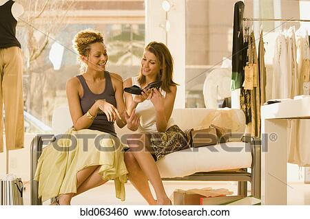 Stock Image - Multi-ethnic women shopping. Fotosearch
