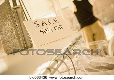 Sale sign in clothing store View Large Photo Image Stock Photograph - Sale sign in clothing store. Fotosearch