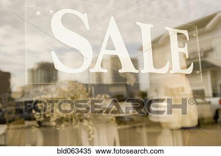 Stock Photography - Sale sign in shop window. Fotosearch