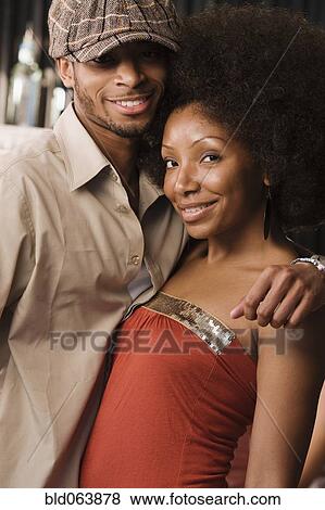 African couple hugging in nightclub View Large Photo Image Stock Photo - African couple hugging in nightclub. Fotosearch