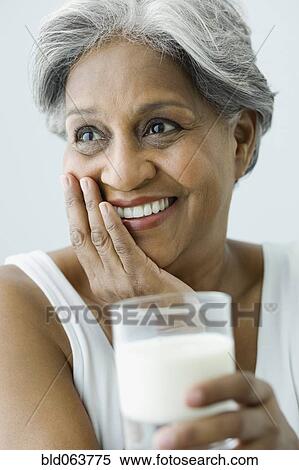 African woman drinking milk View Large Photo Image Stock Photography - African woman drinking milk. Fotosearch