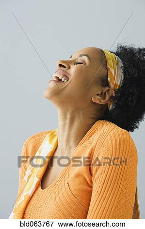 Stock Photo - African woman laughing. Fotosearch