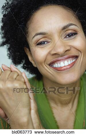 Stock Image - African woman smiling. Fotosearch