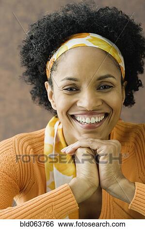 African woman wearing head scarf View Large Photo Image Stock Photograph - African woman wearing head scarf. Fotosearch