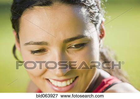 Stock Photo - Close up of Hispanic woman smiling. Fotosearch