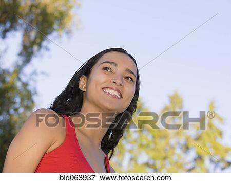 Stock Photo - Close up of Hispanic woman smiling. Fotosearch