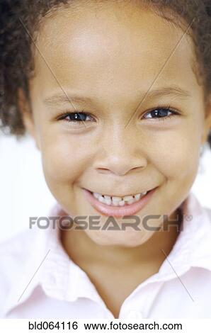 Stock Photograph - Close up of mixed race girl smiling. Fotosearch