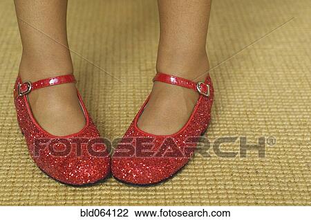 Close up of mixed race girl wearing red shoes View Large Photo Image Stock Image - Close up of mixed race girl wearing red shoes. Fotosearch