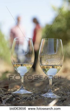 Stock Photograph - Close up of two glasses of white wine. Fotosearch