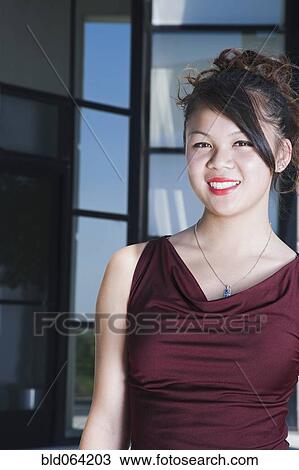 Glamorous Asian woman smiling View Large Photo Image Stock Image - Glamorous Asian woman smiling. Fotosearch