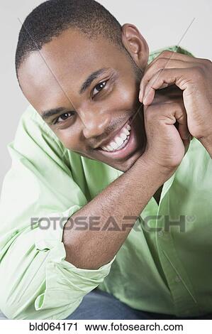 Stock Image - Mixed race man smiling. Fotosearch