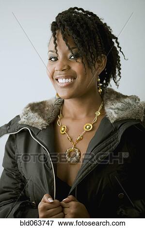 Mixed race woman in fur hooded jacket View Large Photo Image Stock Photo - Mixed race woman in fur hooded jacket. Fotosearch