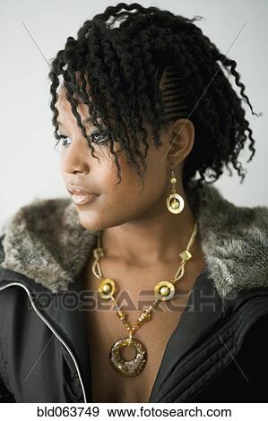 Mixed race woman in fur hooded jacket View Large Photo Image Stock Photo - Mixed race woman in fur hooded jacket. Fotosearch