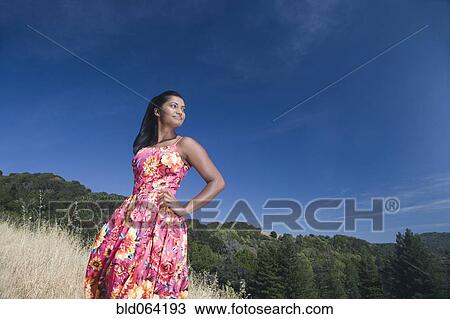 Mixed race woman in sundress in rural area View Large Photo Image Stock Image - Mixed race woman in sundress in rural area. Fotosearch