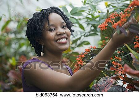 Mixed race woman smiling outdoors View Large Photo Image Picture - Mixed race woman smiling outdoors. Fotosearch