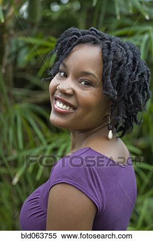Mixed race woman smiling outdoors View Large Photo Image Stock Photography - Mixed race woman smiling outdoors. Fotosearch