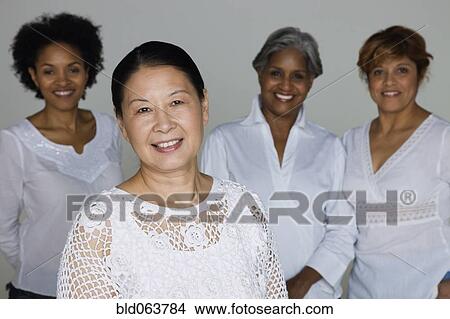 Multi-ethnic friends smiling View Large Photo Image Picture - Multi-ethnic friends smiling. Fotosearch