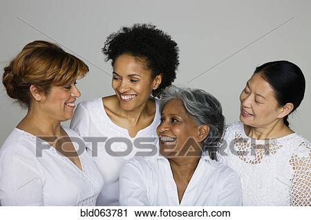 Stock Image - Multi-ethnic friends smiling. Fotosearch