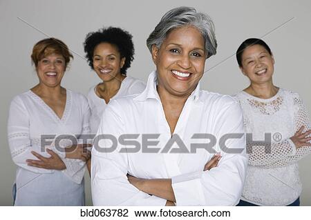 Stock Image - Multi-ethnic friends smiling. Fotosearch