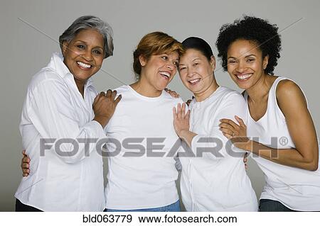 Stock Photo - Multi-ethnic friends smiling. Fotosearch