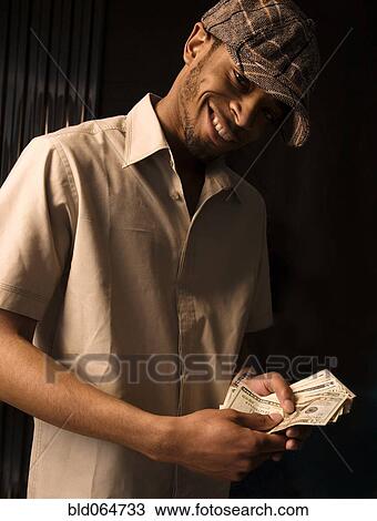 African man counting money View Large Photo Image Stock Image - African man counting money. Fotosearch