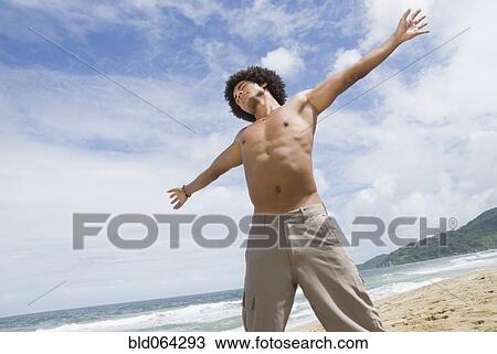 African man relaxing at beach View Large Photo Image Stock Image - African man relaxing at beach. Fotosearch