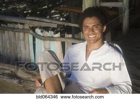 African man relaxing in beach hut View Large Photo Image Stock Photograph - African man relaxing in beach hut. Fotosearch