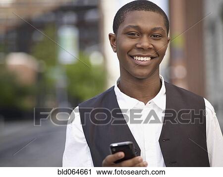 African man text messaging on cell phone View Large Photo Image Stock Image - African man text messaging on cell phone. Fotosearch
