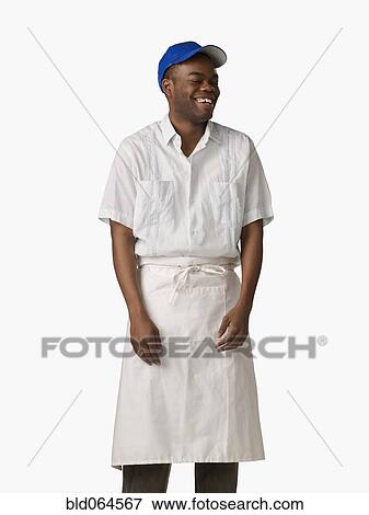Stock Photo - African man wearing cook’s uniform. Fotosearch