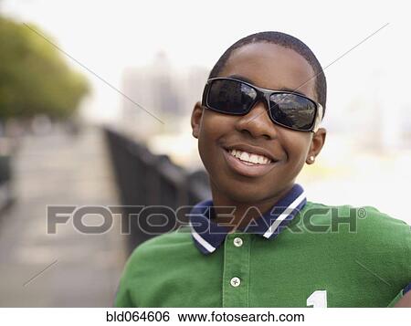 African teenage boy in sunglasses smiling View Large Photo Image Stock Photograph - African teenage boy in sunglasses smiling. Fotosearch