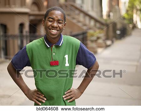 African teenage boy laughing in urban setting View Large Photo Image Stock Photo - African teenage boy laughing in urban setting. Fotosearch