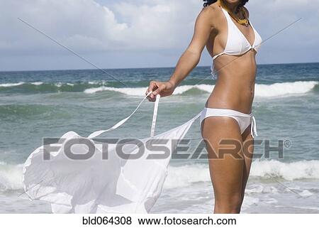 Stock Photo - African woman in bikini at beach. Fotosearch