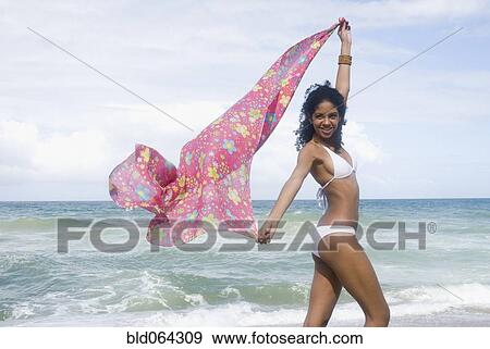 Stock Photo - African woman in bikini at beach. Fotosearch