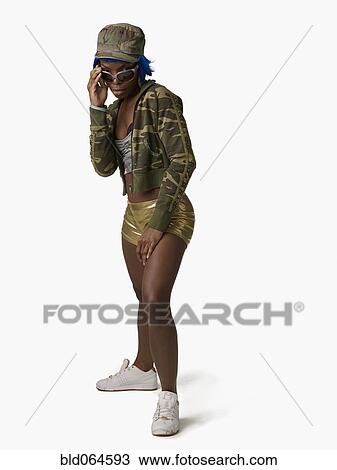 Stock Image - Aggressive African woman in sunglasses. Fotosearch