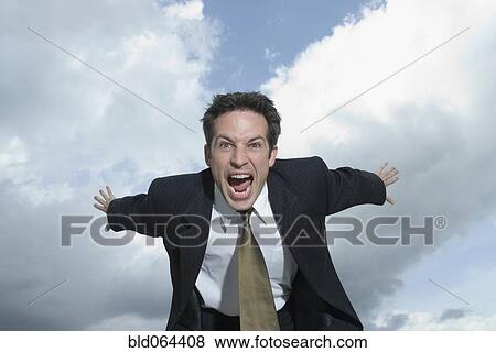 Stock Photo - Angry Hispanic businessman shouting. Fotosearch