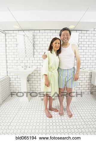Asian husband and wife in bathroom together View Large Photo Image Picture - Asian husband and wife in bathroom together. Fotosearch