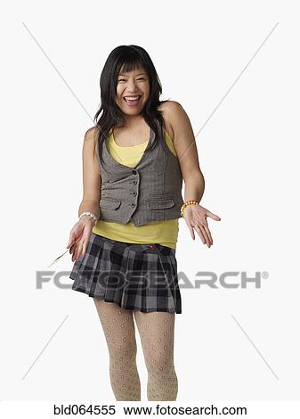 Stock Photography - Asian woman wearing miniskirt. Fotosearch