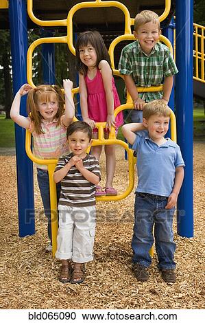Stock Image - Children playing in playground. Fotosearch