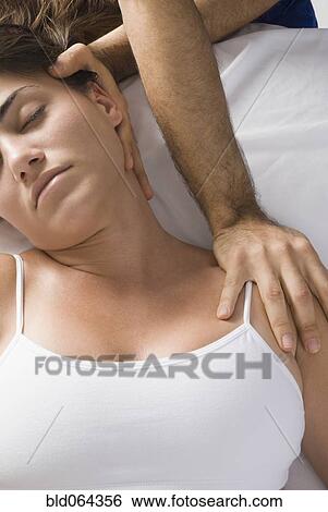 Chiropractor adjusting woman’s neck View Large Photo Image Stock Photograph - Chiropractor adjusting woman’s neck. Fotosearch