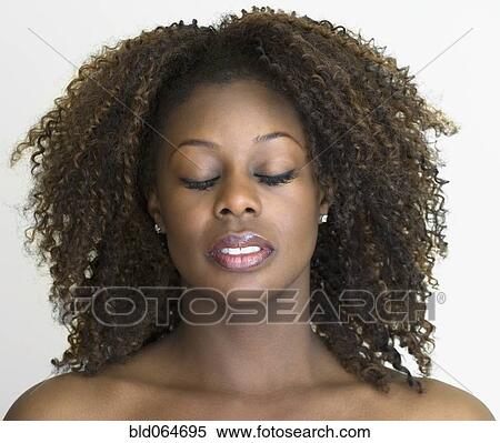 Close up of African woman with eyes closed View Large Photo Image Stock Photography - Close up of African woman with eyes closed. Fotosearch