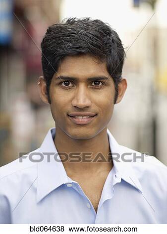Stock Photo - Close up of confident Indian man. Fotosearch