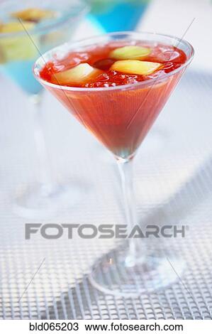 Stock Image - Close up of exotic cocktail in martini glass. Fotosearch