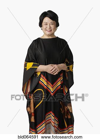Stock Image - Confident Asian woman smiling. Fotosearch