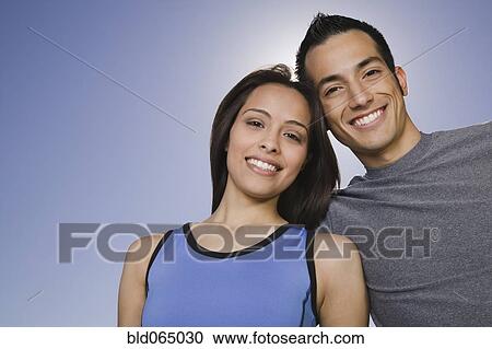 Confident Hispanic couple smiling View Large Photo Image Stock Image - Confident Hispanic couple smiling. Fotosearch