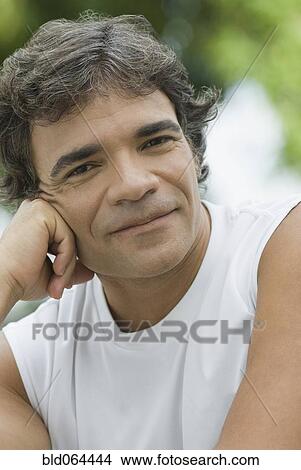Picture - Confident Hispanic man smiling. Fotosearch