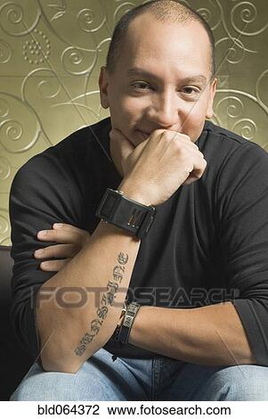 Confident Hispanic man smiling View Large Photo Image Stock Image - Confident Hispanic man smiling. Fotosearch
