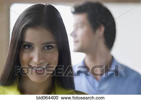 Stock Image - Confident Hispanic woman smiling. Fotosearch